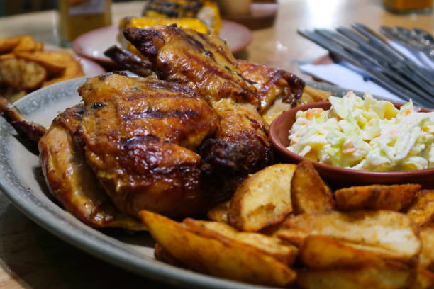 Guests enjoying peri peri chicken, burgers, wraps, and sides together